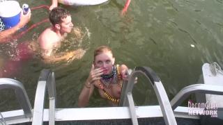 Hot Coed and MILF Play Naked on a Raft in Front of Huge Crowd 1