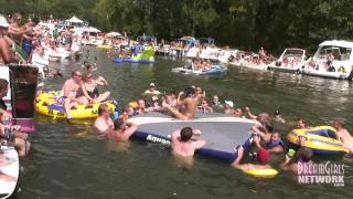 Hot Coed and MILF Play Naked on a Raft in Front of Huge Crowd 4