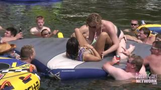 Hot Coed and MILF Play Naked on a Raft in Front of Huge Crowd 9