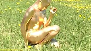 Ebony Babe in Skintight Golden Spandex Catsuit Posing Outdoor 1