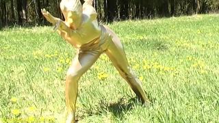 Ebony Babe in Skintight Golden Spandex Catsuit Posing Outdoor 7