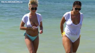 Two Hotties in Bikinis and Wet T-Shirts Playing at the Beach Flashing Boob 11