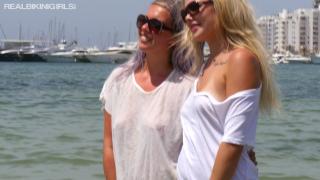 Two Young Sexy Blondes in Wet T-Shirts in the Sea
