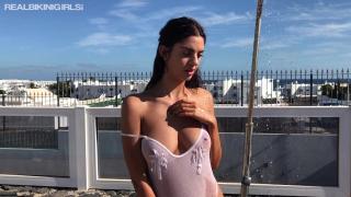 Young Tanned Brunette Goddess Topless using Rooftop Shower 9