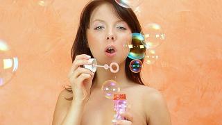 Teen Plays with Soap Bubbles
