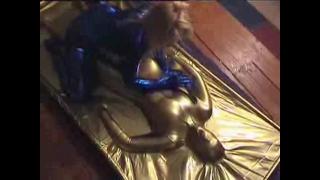 KERRI IN VAC BED FONDLED & TEASED BY BEV COCKS IN BLUE LYCRA 11