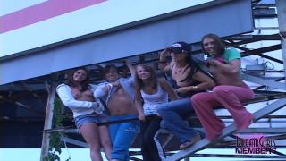 Group of Party Girls Flash Atop a Highway Billboard 5