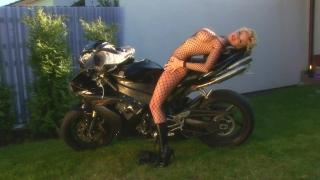 Big Tit Blonde Motorcycle Model Fingering her Pussy on the Grass 2